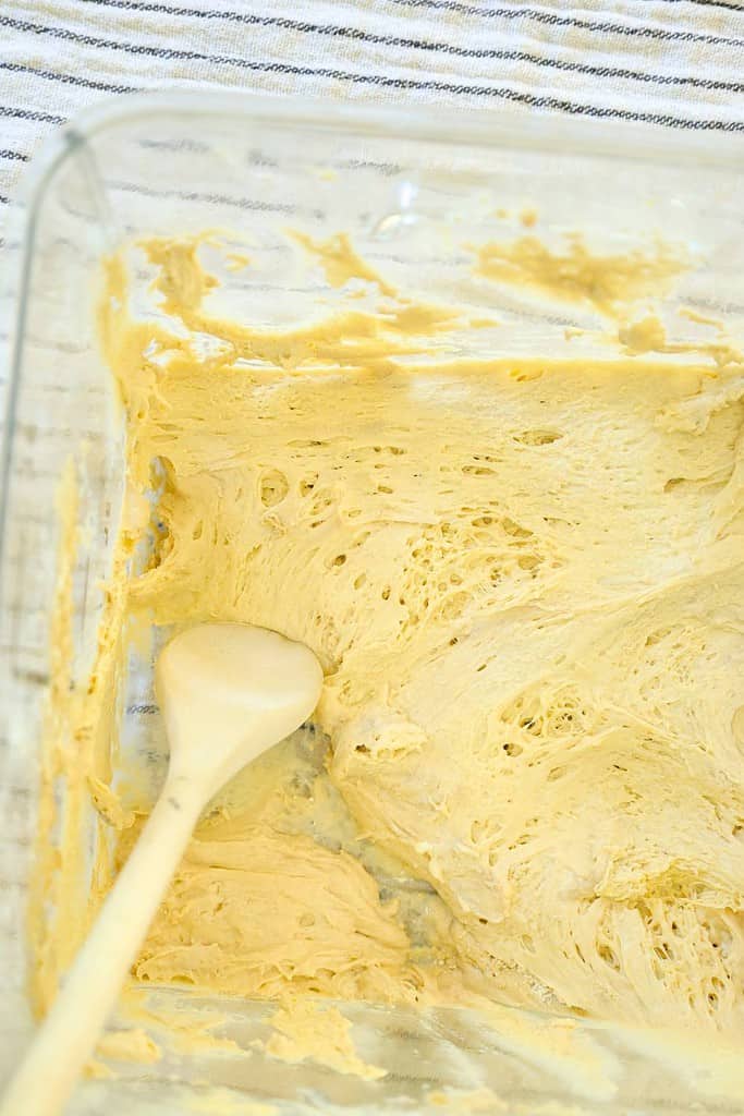 dough-reserve-with-wooden-spoon-in-tub