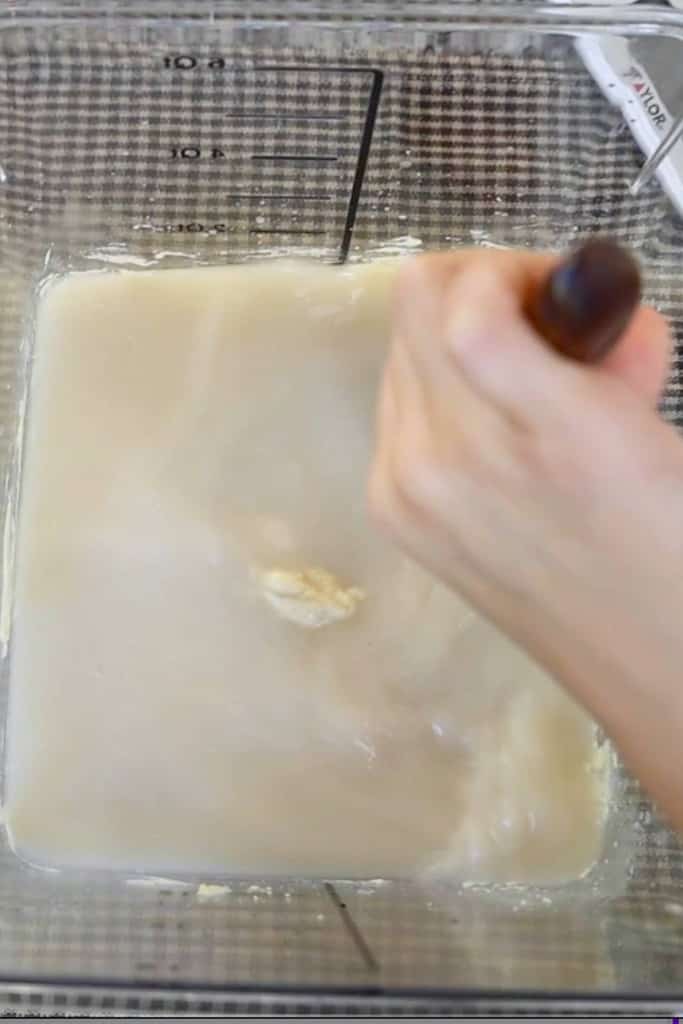 mixing-the-yeast-and-salt-and-water-into-dough-reserve