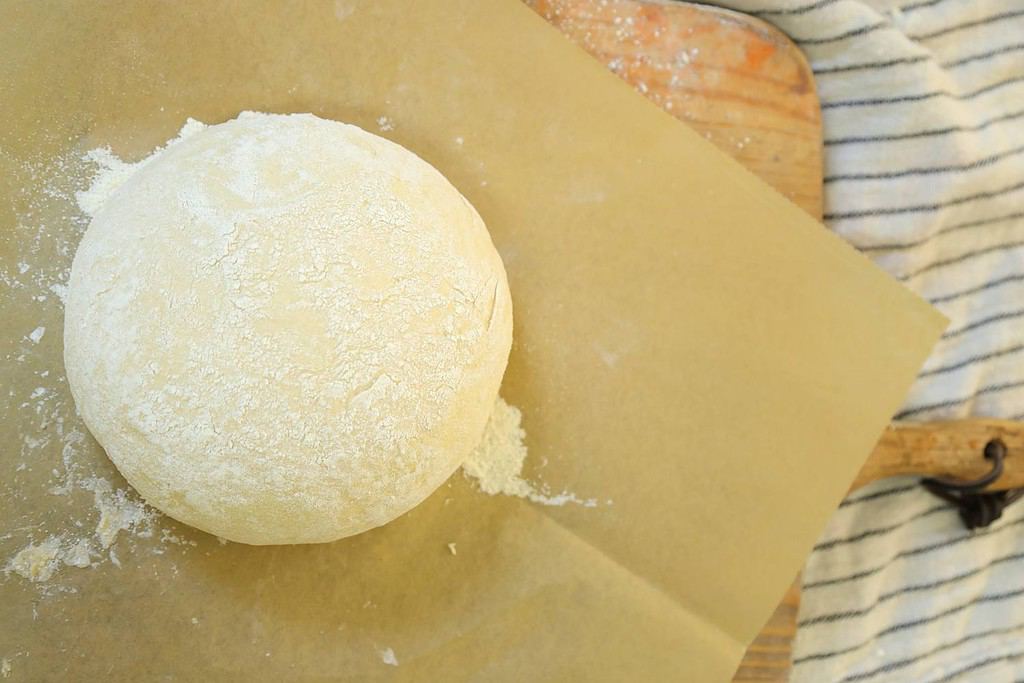 shaped-dough-sitting-on-parchment-on-a-bread-board
