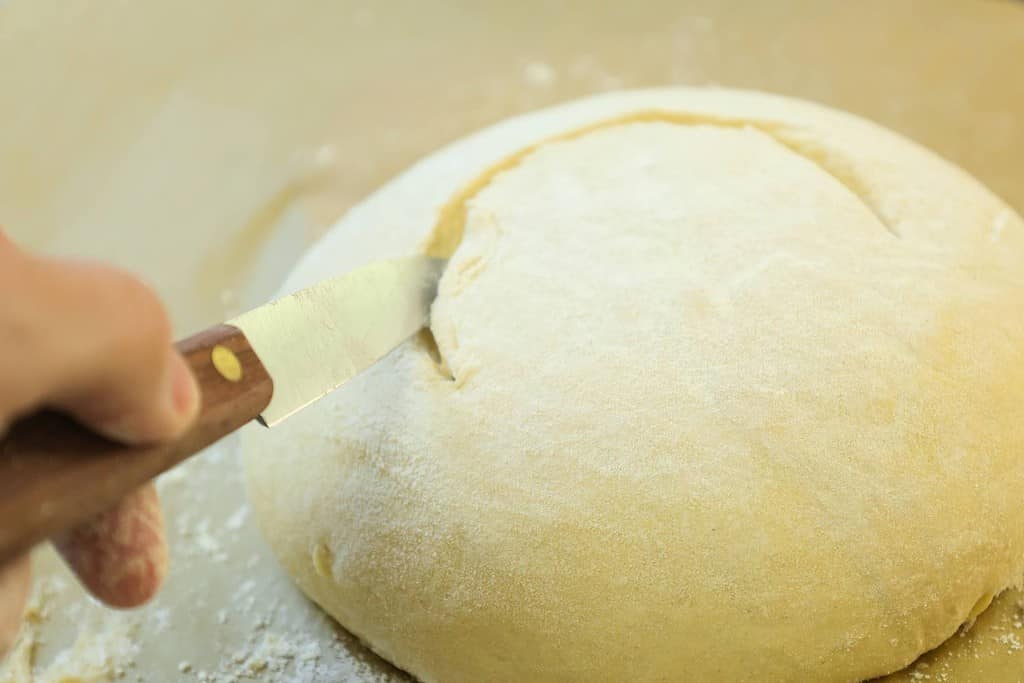 slashing-the-dough-ball-with-knife