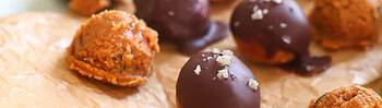 Peanut-Butter-Chocolate-Chip-Cookie-Dough-Energy-Balls on plate next to celtic sea salt